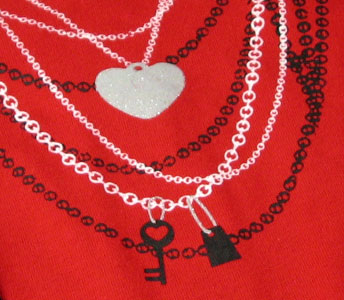 Close-up of shirt with jewelry on it