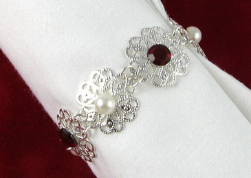 Close-up of silver-plated filigree napkin ring